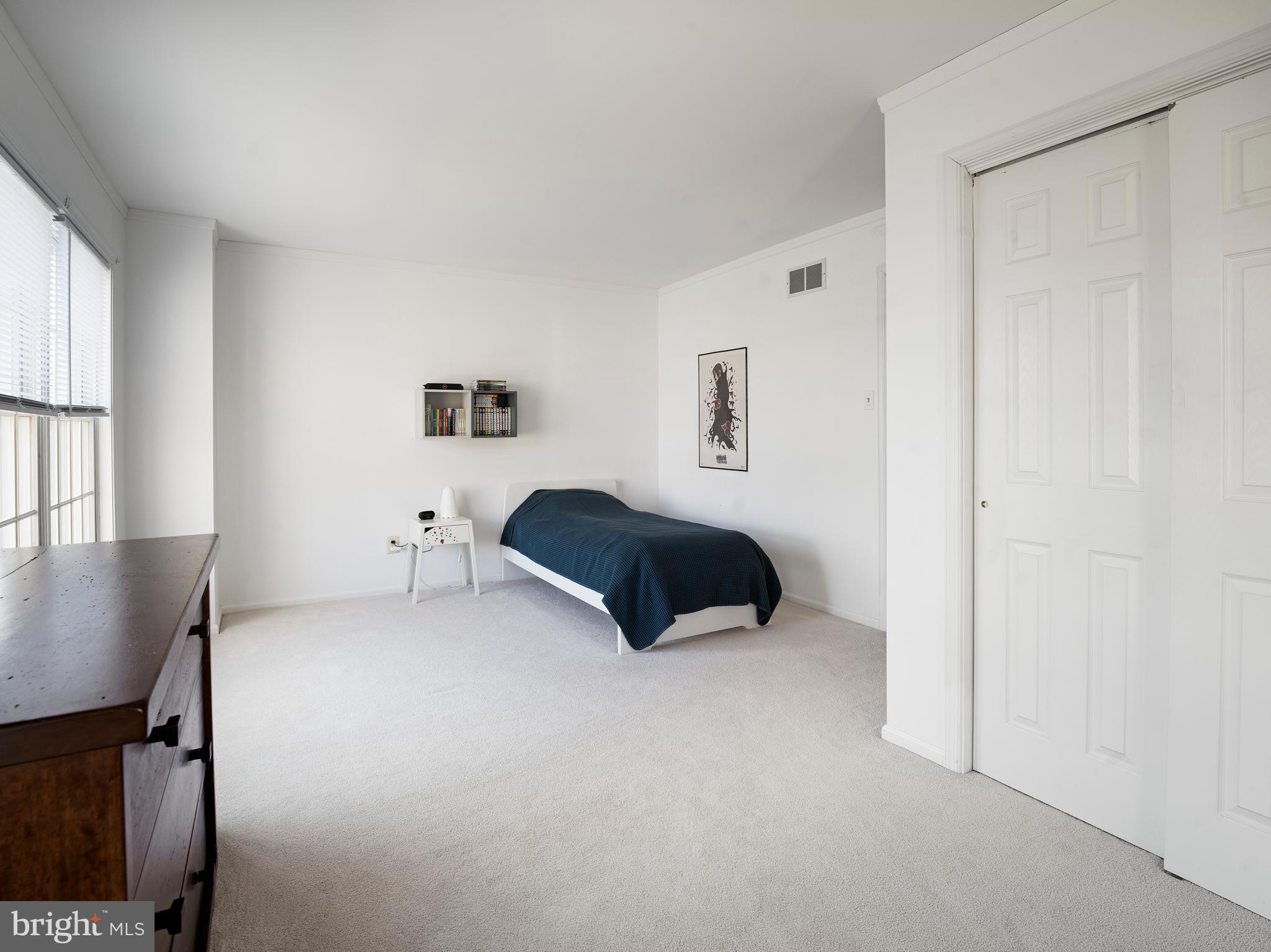 534 Pewter Drive Exton, PA 19341 - Photo 22 of 39 a spacious bedroom with a bed and a window