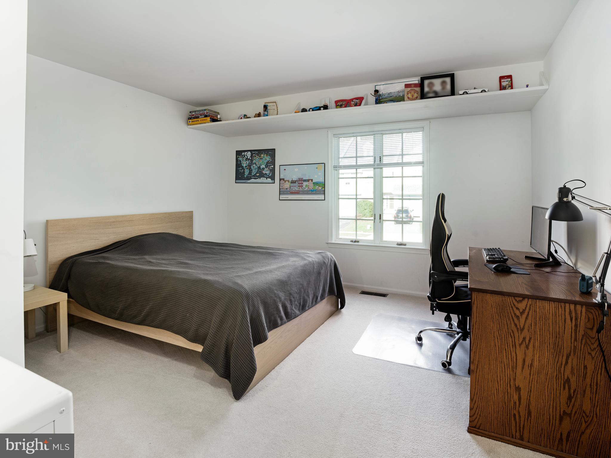 534 Pewter Drive Exton, PA 19341 - Photo 24 of 39 a bedroom with a bed and a desk