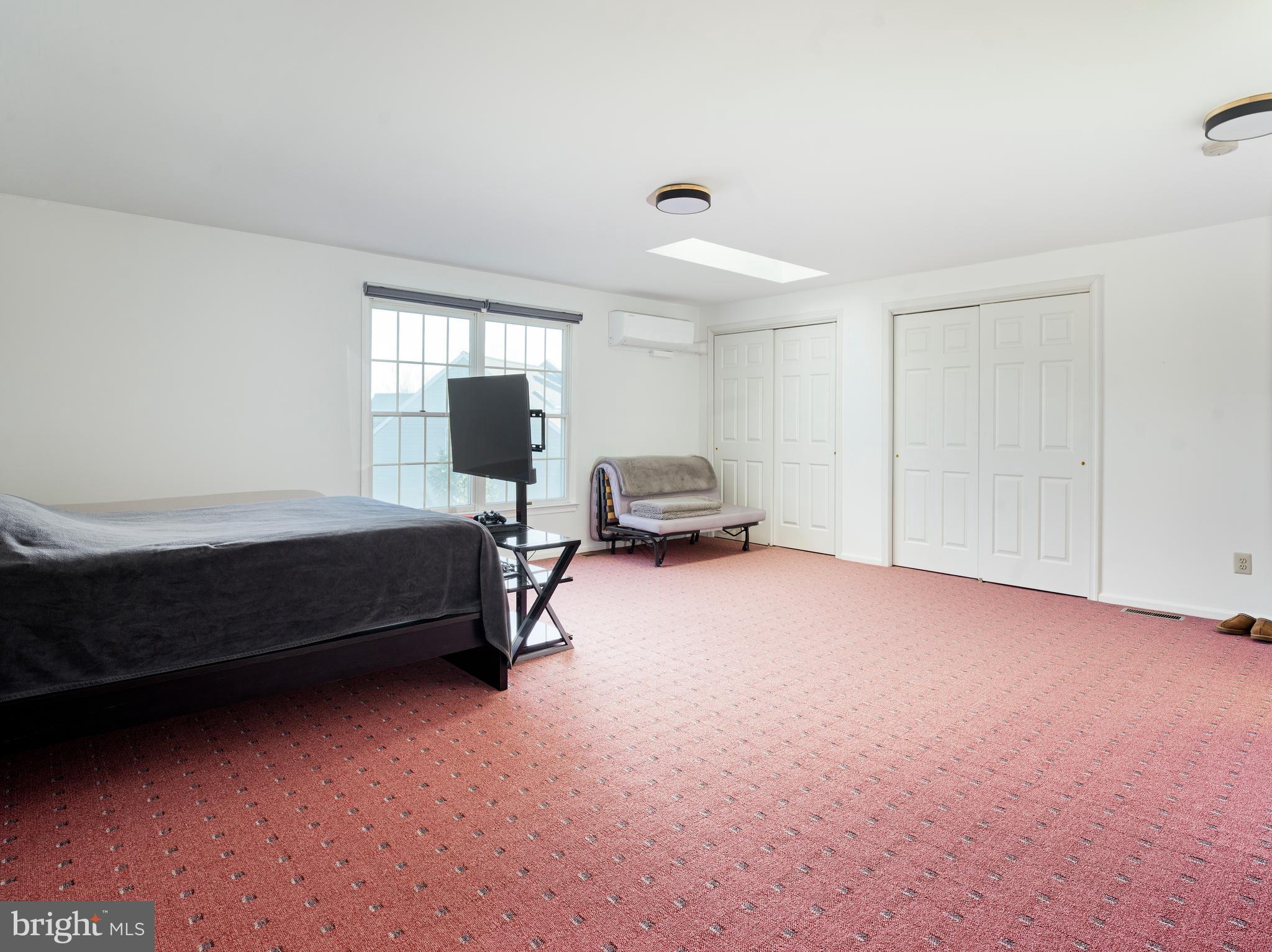 534 Pewter Drive Exton, PA 19341 - Photo 27 of 39 a bedroom with a bed and wooden floor