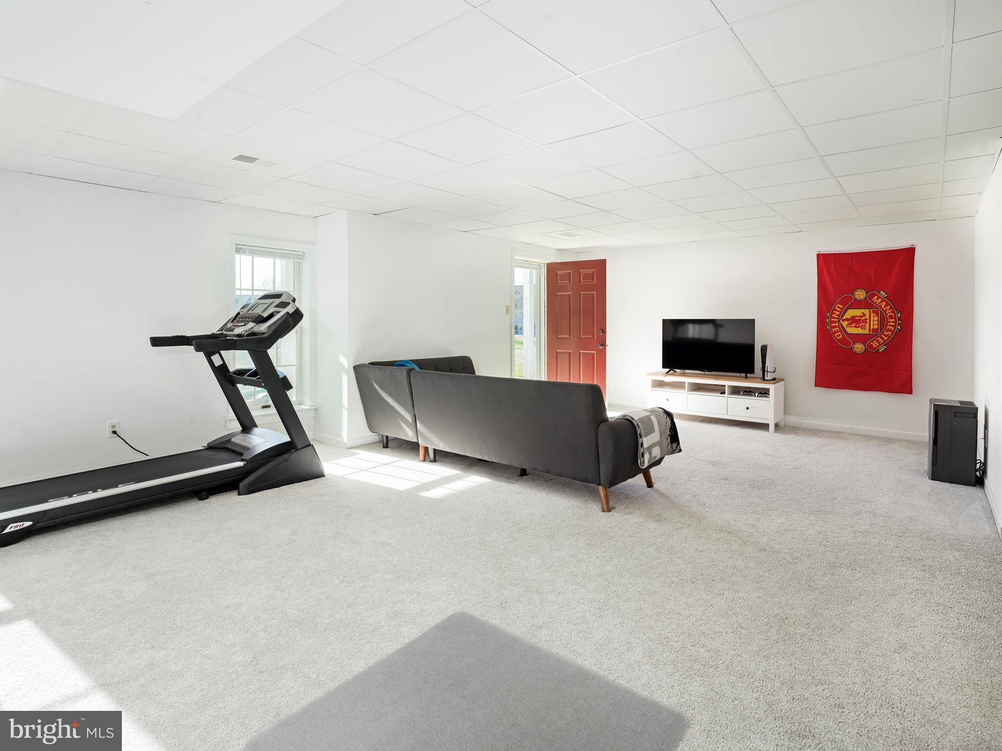 534 Pewter Drive Exton, PA 19341 - Photo 30 of 39 a room with gym equipment and a flat screen tv