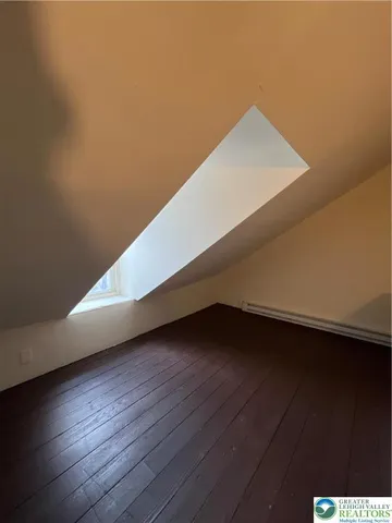 a view of wooden floor in a hall