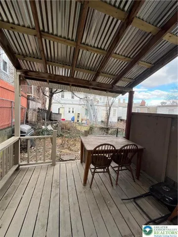 a view of a chairs and table on the deck