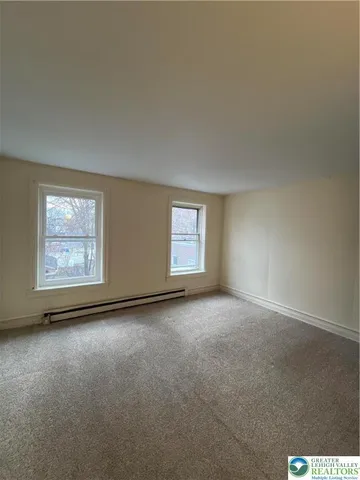 an empty room with windows