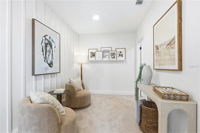 a bedroom with a bed and a painting