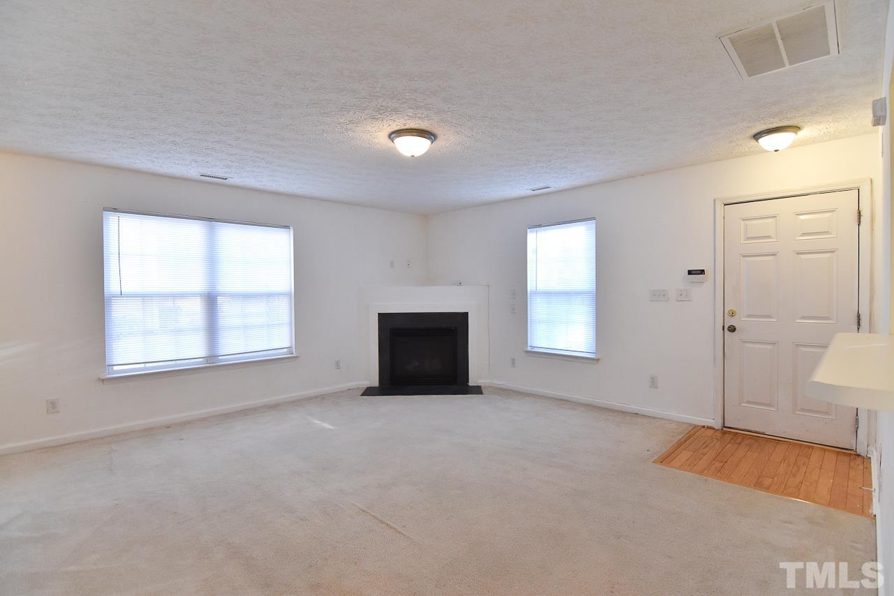 5709 Forest Point Road Raleigh, NC 27610 - Photo 12 of 19 an empty room with windows and closet