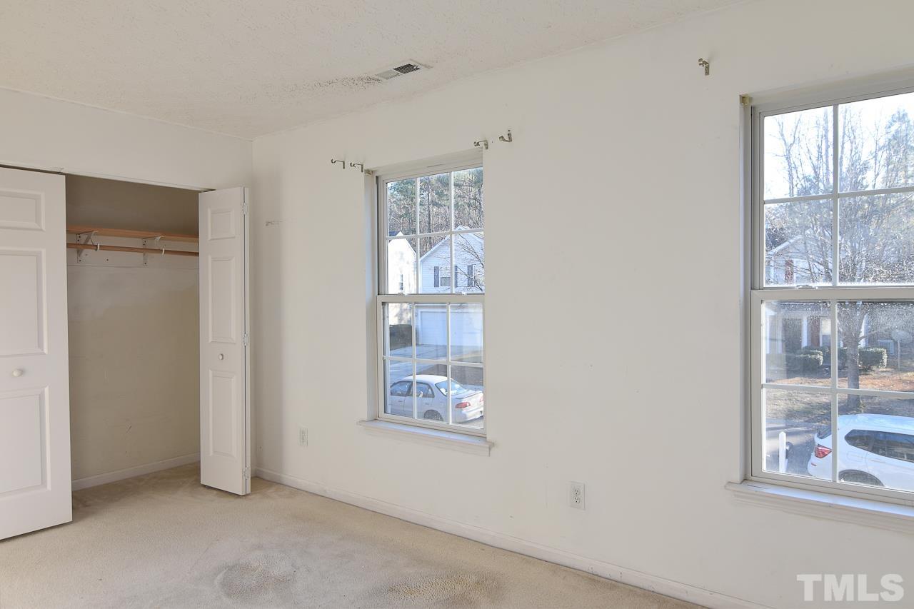 5709 Forest Point Road Raleigh, NC 27610 - Photo 15 of 19 an empty room with windows
