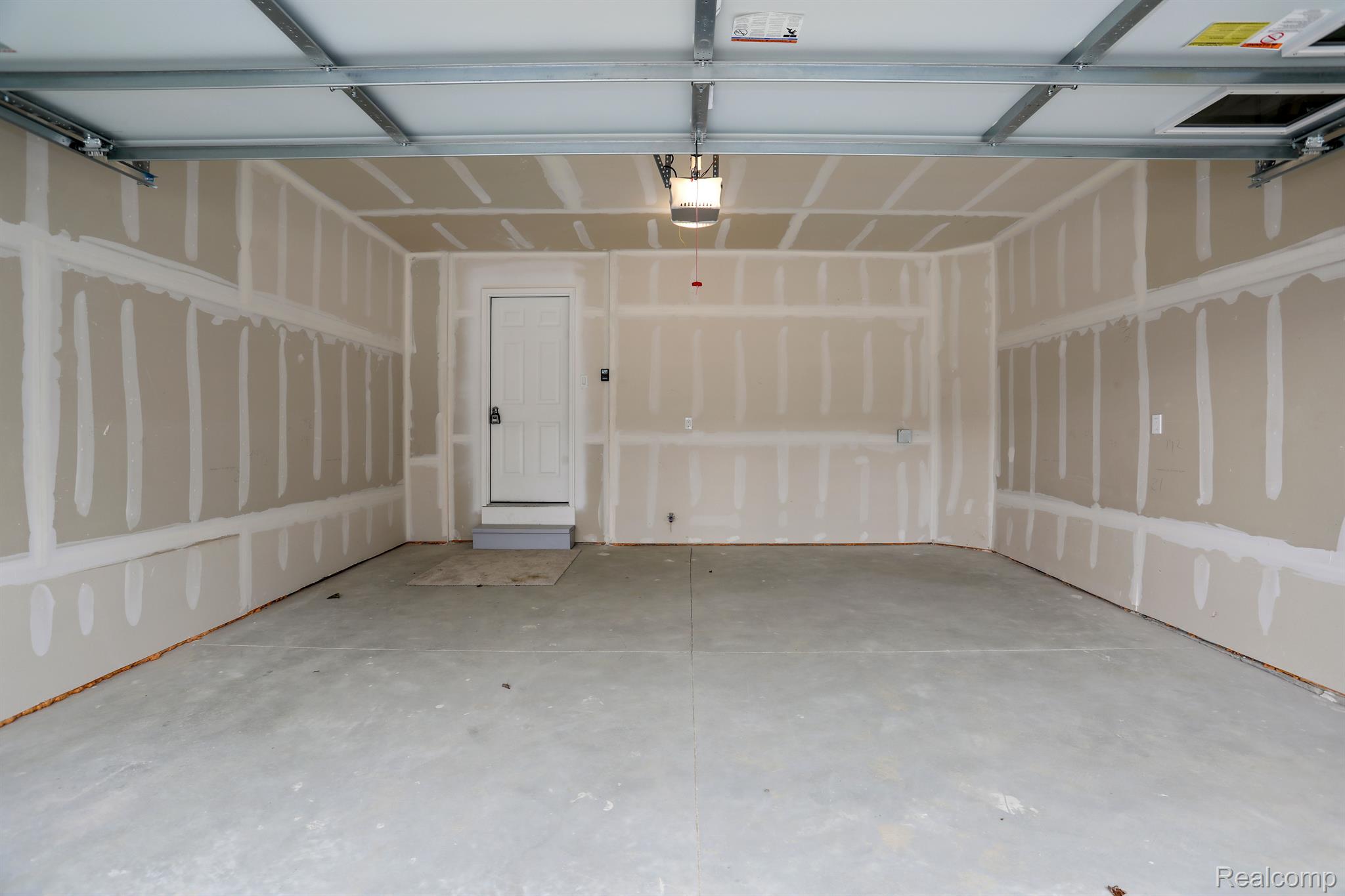 3012 Canopy Tree Way, Unit 9 Ann Arbor, MI 48103 - Photo 34 of 38 2 car attached garage with electric car charging