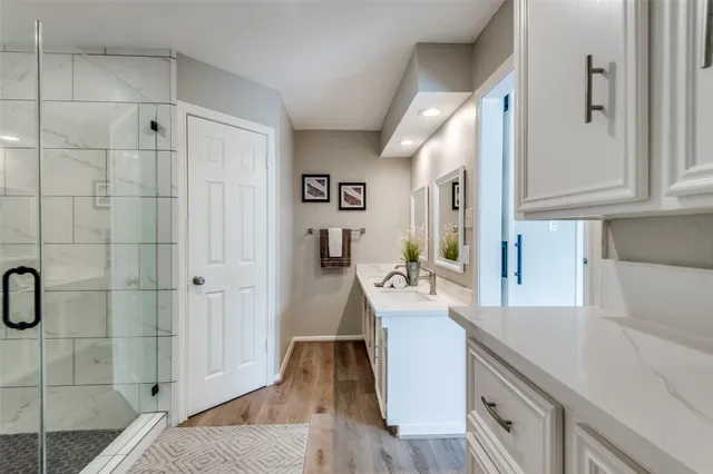 a living room with granite countertop furniture and a wooden floor