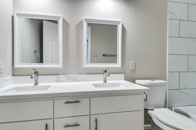 a bathroom with a sink and a toilet