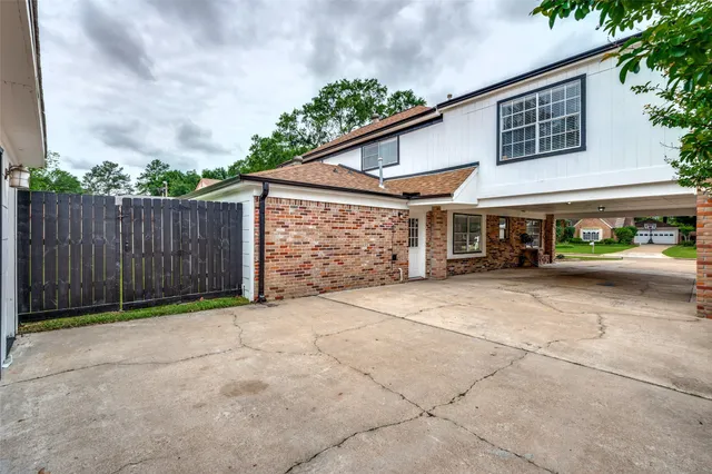 a backyard of a house with lots of green space and garage