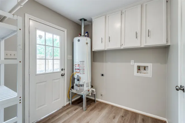 a room with wooden floor and a window