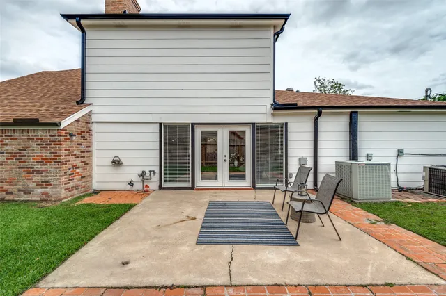a view of a house with a yard and sitting area