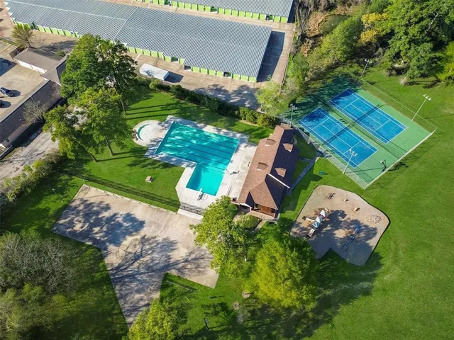 an aerial view of a house with a garden