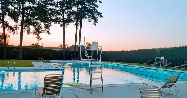 a view of a swimming pool with a patio