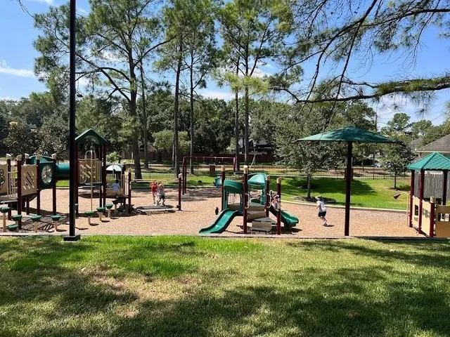 a view of a park with swings