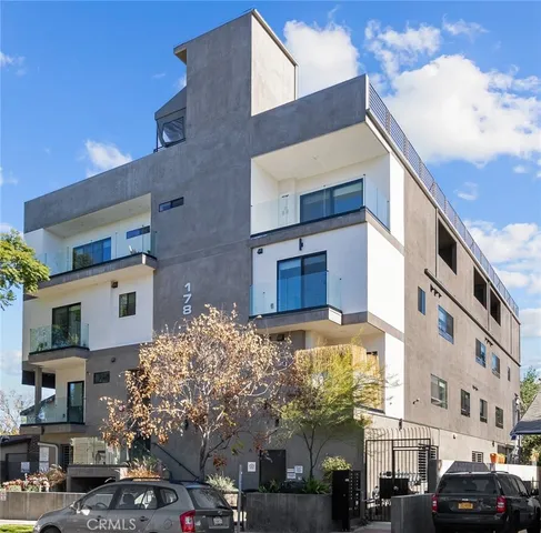 a front view of a building with street view