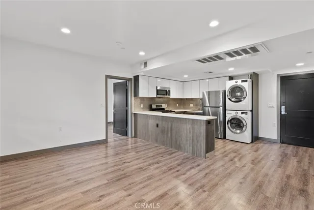 a view of entryway with wooden floor