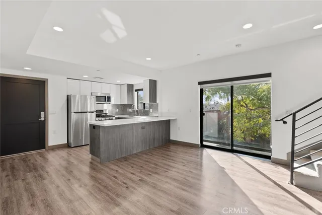 a utility room with sink dryer and washer