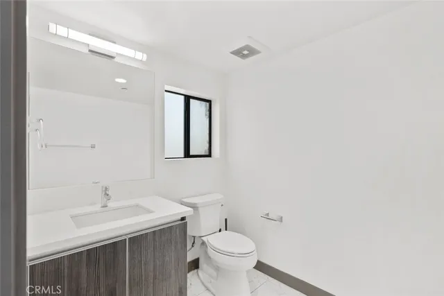 a kitchen with stainless steel appliances granite countertop a stove top oven and sink