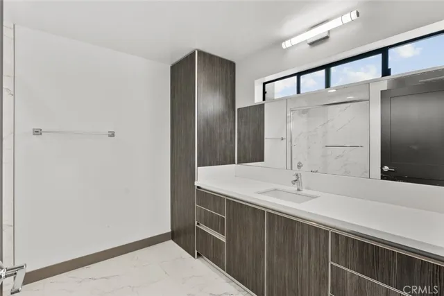 a view of a kitchen with a sink and a window
