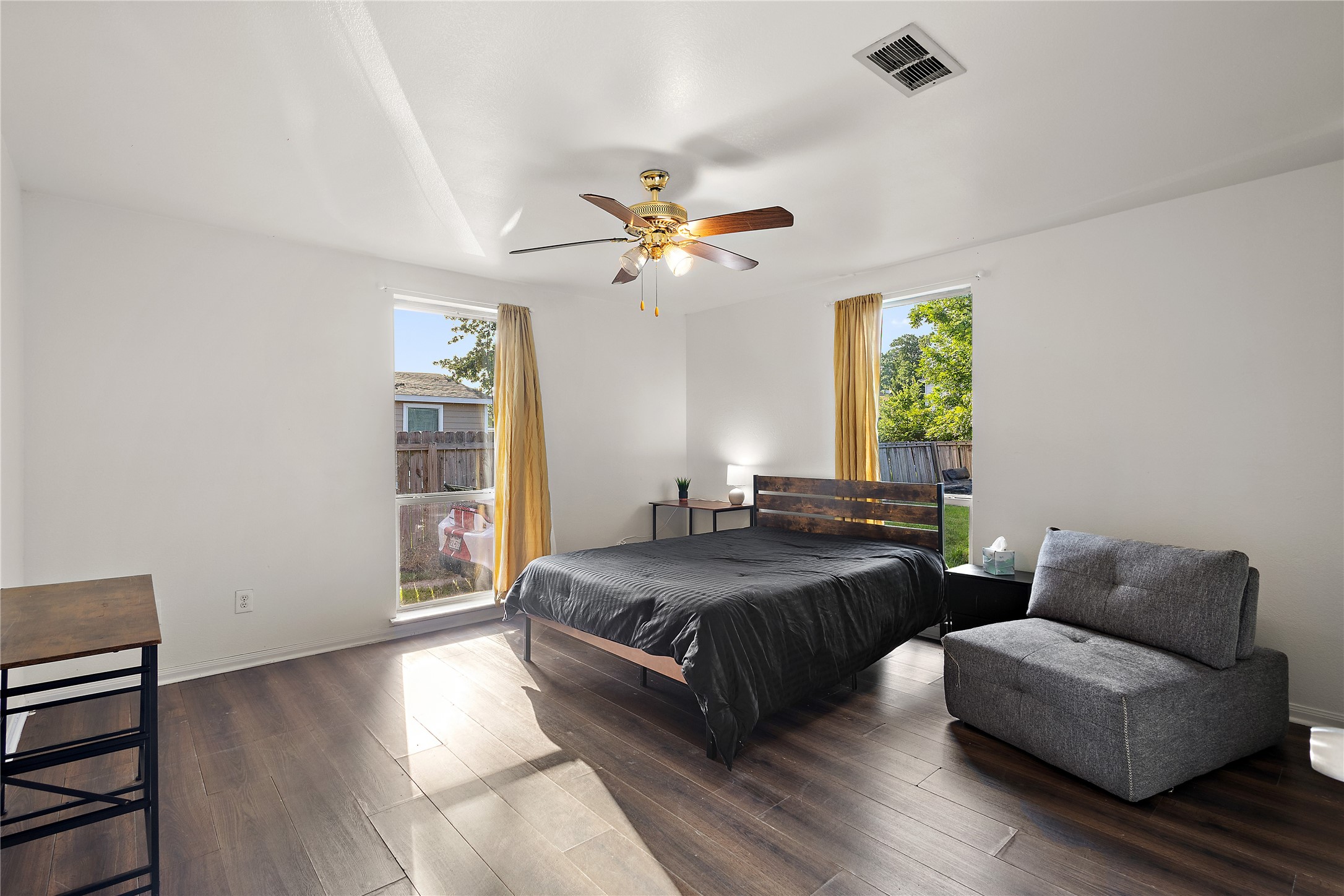 225 Palmyra Street Houston, TX 77022 - Photo 5 of 11 Generously sized, fully furnished primary bedroom offering plenty of space to relax and unwind after a long day.