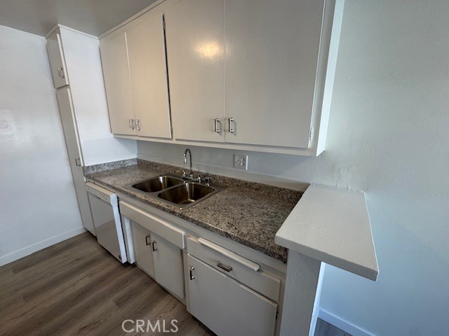 7524 Haskell Avenue, Unit 5 Van Nuys, CA 91406 - Photo 11 of 15 a kitchen with stainless steel appliances granite countertop a sink stove and cabinets