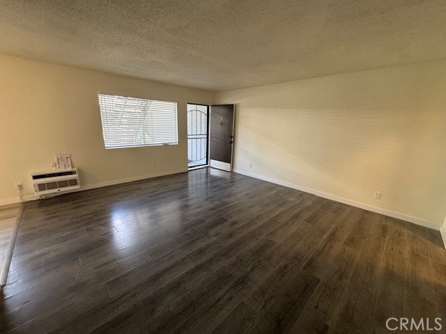 7524 Haskell Avenue, Unit 5 Van Nuys, CA 91406 - Photo 15 of 15 an empty room with wooden floor and windows