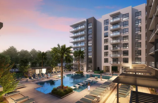 a view of a patio with swimming pool and sitting area