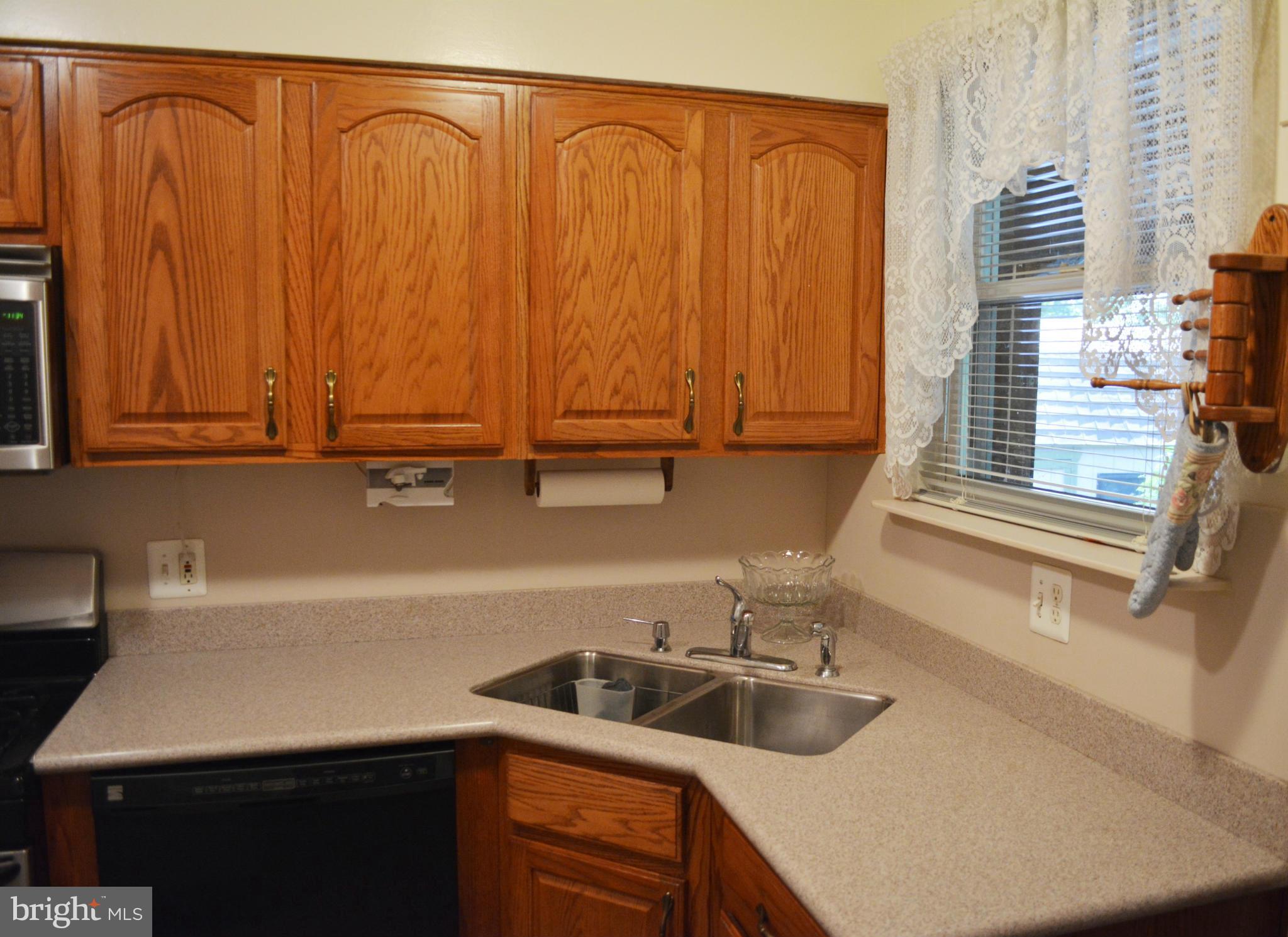 2117 Rolander Street Hyattsville, MD 20783 - Photo 5 of 30 a kitchen with a sink and cabinets