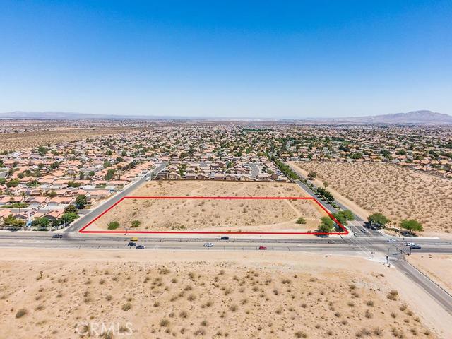 0 Bear Valley Road Victorville, CA 92392 - Photo 2 of 3 a view of a dry yard with wooden fence