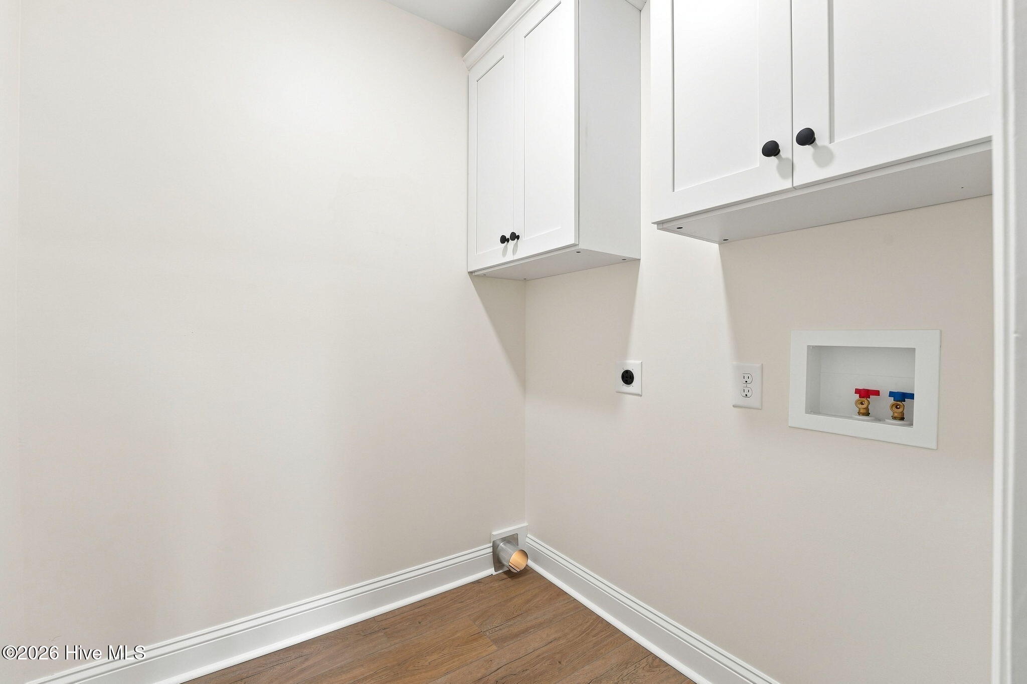 611 Sun Road Aberdeen, NC 28315 - Photo 18 of 59 Laundry room with new cabinetry