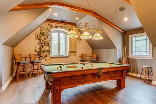 a bathroom with a shower sink and mirror