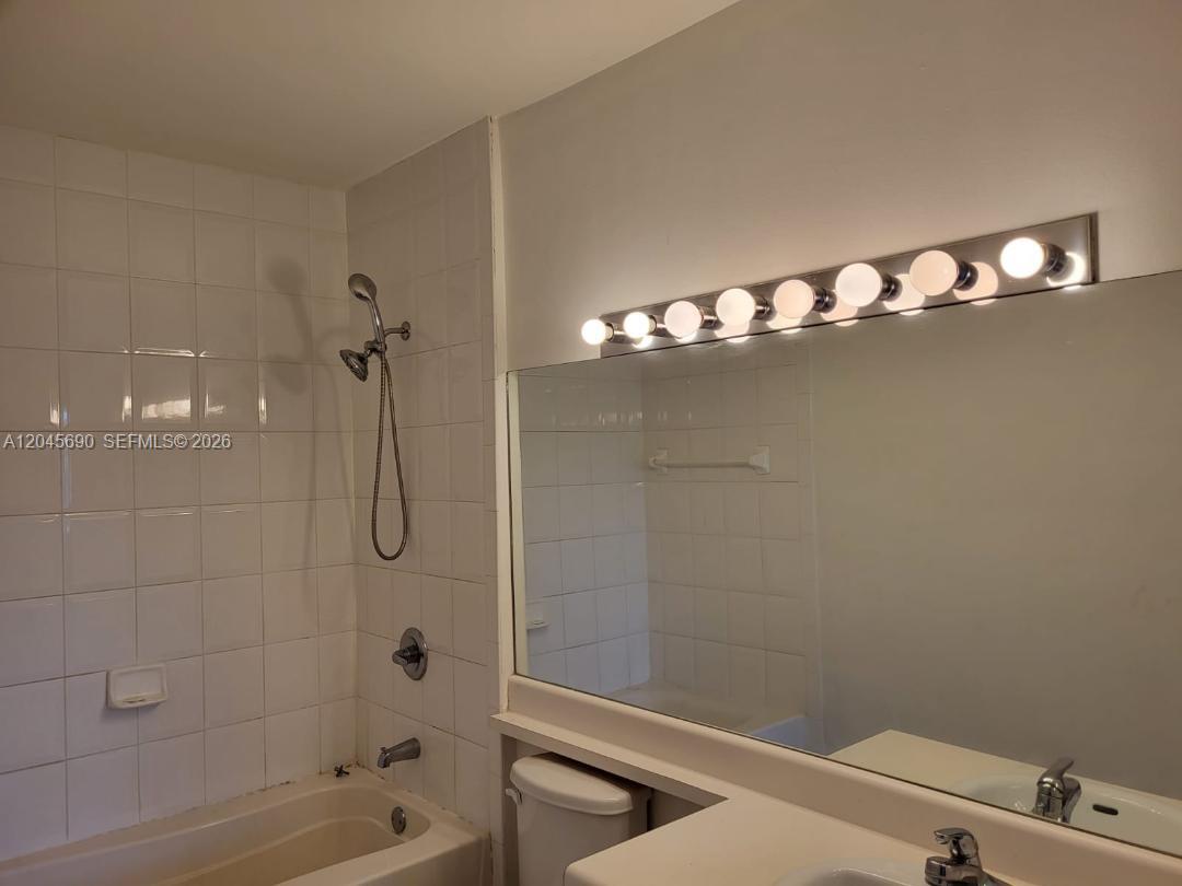 8070 North Nob Hill Road, Unit 208 Tamarac, FL 33321 - Photo 9 of 16 a bathroom with a shower