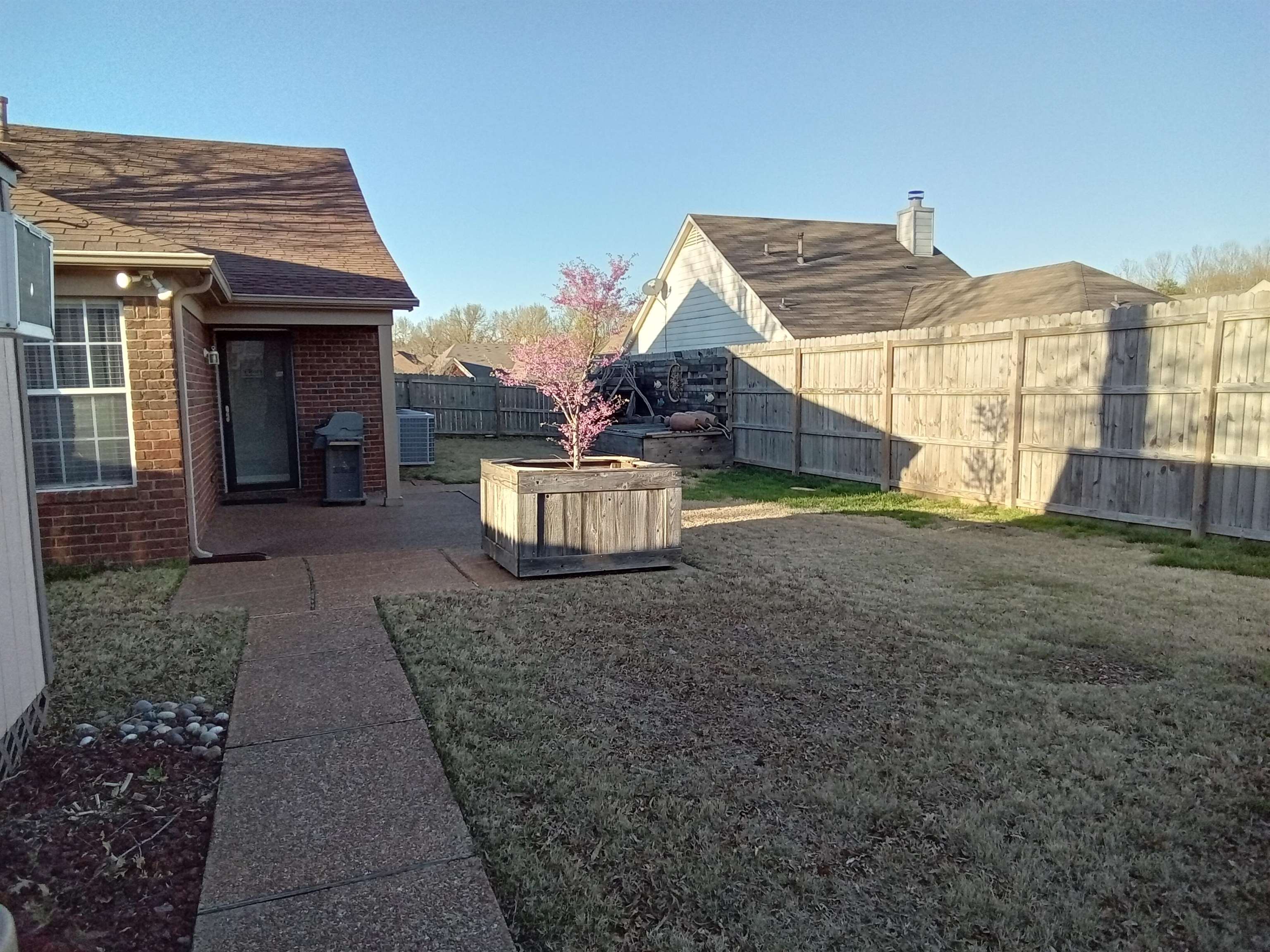 6907 Manslick Road Cordova, TN 38018 - Photo 18 of 24 Fenced backyard featuring a patio