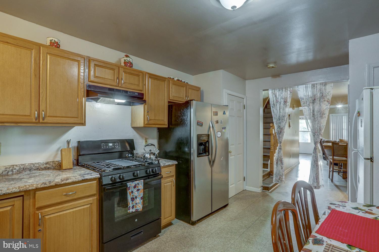 417 Green Street Lancaster, PA 17602 - Photo 20 of 37 a kitchen with stainless steel appliances granite countertop a refrigerator a stove and a sink