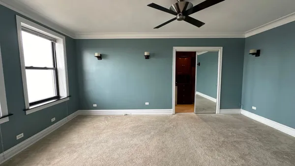 a view of an empty room with a window