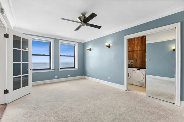 a view of an empty room with a window