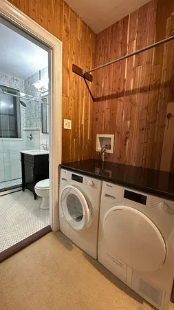 a utility room with dryer and washer