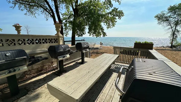 an outdoor sitting area with furniture