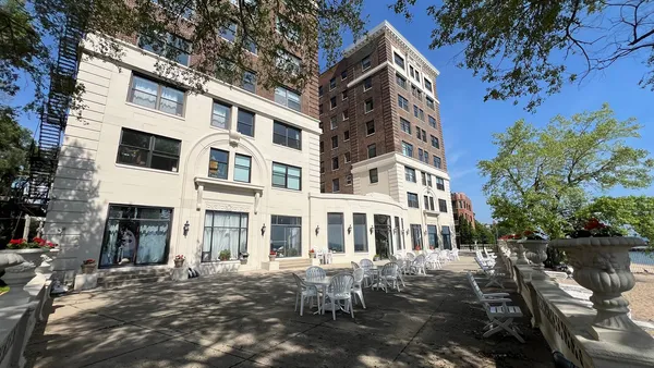 a view of a building with a yard