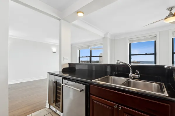 a kitchen that has a sink and a stove