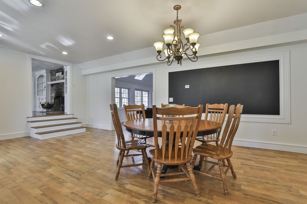 207 Oakridge Road Plaistow, NH 03865 - Photo 17 of 42 a view of a dining room with furniture and wooden floor