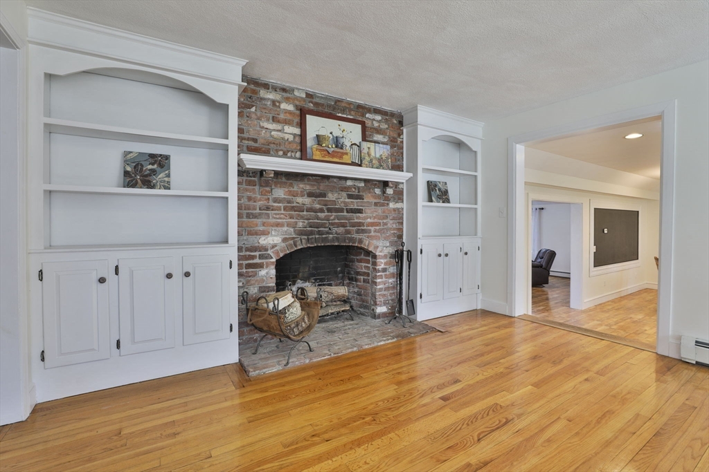 207 Oakridge Road Plaistow, NH 03865 - Photo 23 of 42 a living room with furniture and a fireplace