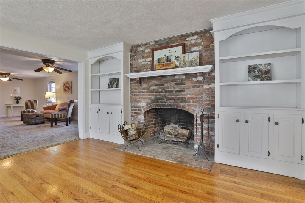 207 Oakridge Road Plaistow, NH 03865 - Photo 24 of 42 a living room with furniture and a fireplace