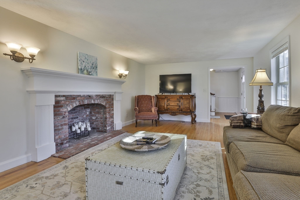207 Oakridge Road Plaistow, NH 03865 - Photo 25 of 42 a living room with furniture and a fireplace