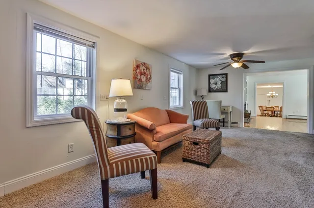 a living room with furniture and a window