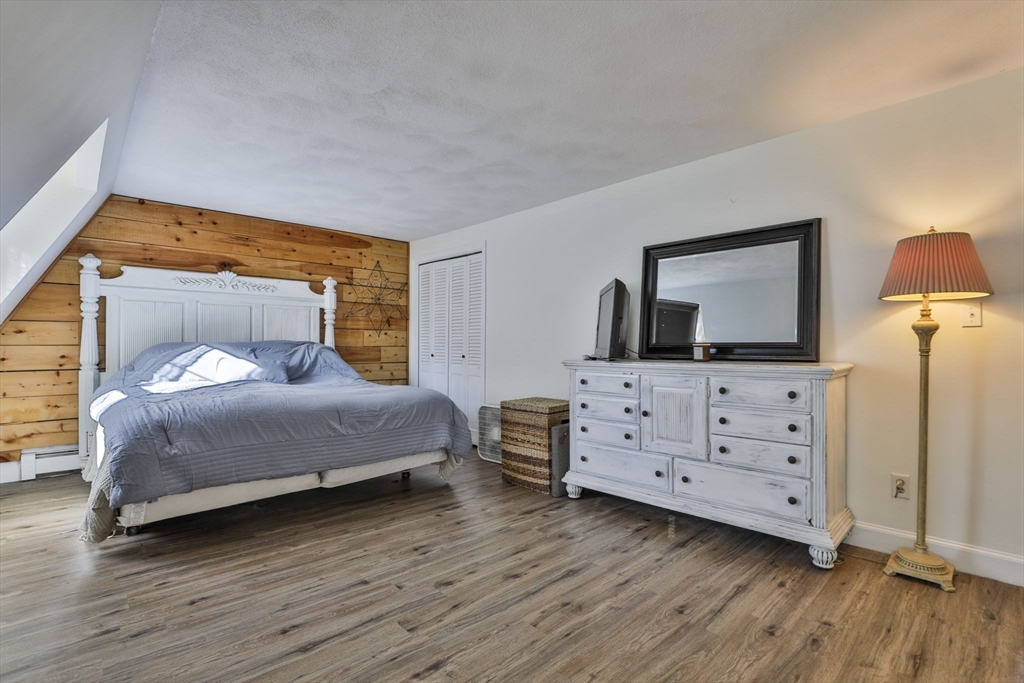 207 Oakridge Road Plaistow, NH 03865 - Photo 33 of 42 a bedroom with a bed and a dresser