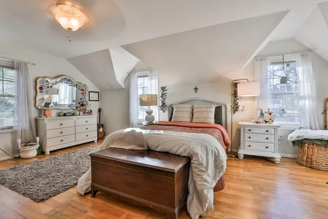 a bedroom with a bed and a dresser