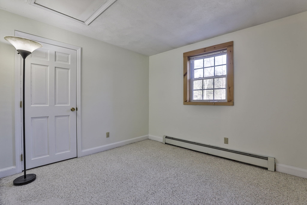 207 Oakridge Road Plaistow, NH 03865 - Photo 38 of 42 an empty room with windows