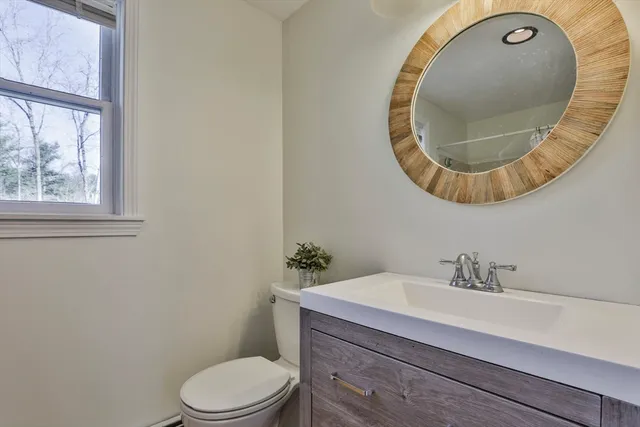 a bathroom with a toilet and a sink